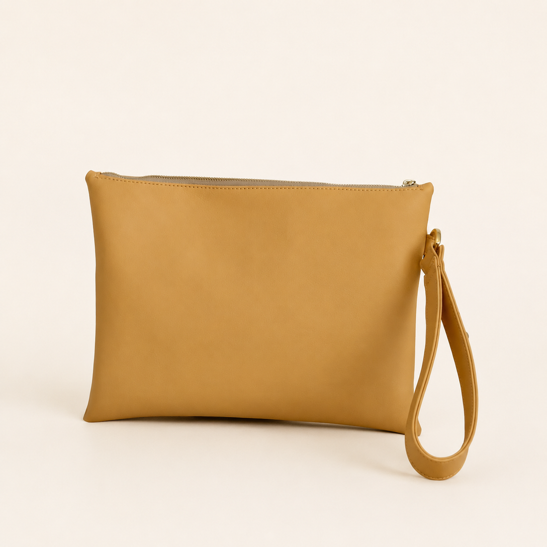 Made from Corkskin, an innovative cork-based material, its unique texture is complemented by refined details and decorative studs that add a subtle edge to its minimalist design.