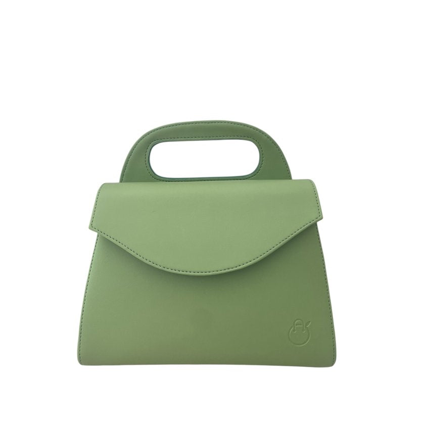 Green handbag with a small handle on a white background