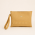 Made from Corkskin, an innovative cork-based material, its unique texture is complemented by refined details and decorative studs that add a subtle edge to its minimalist design.
